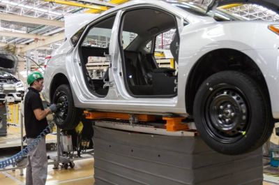 Mexico’s efforts to develop its economy have made it one of the world’s top 10 car-exporting nations. NAFTA was one of those efforts. A worker screws a wheel of a car in a Nissan factory in Aguascalientes in 2014.  Ginnette Riquelme  - MCT